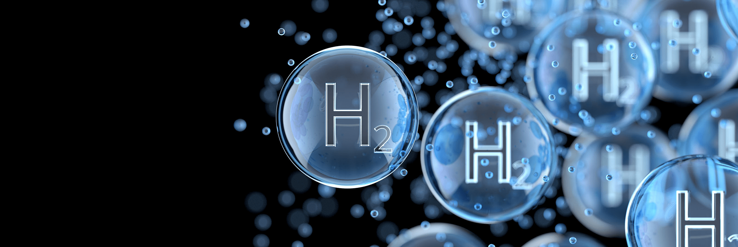 Blue transparent spheres with the letter H on them, with a black background.  Meant to resemble molecules