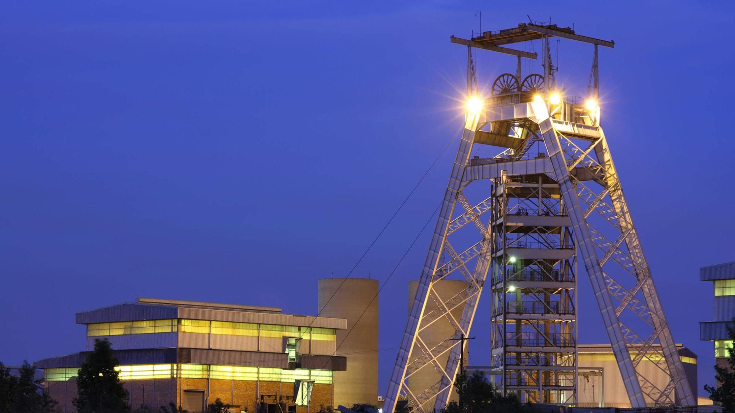 Gold mine pulley tower at night