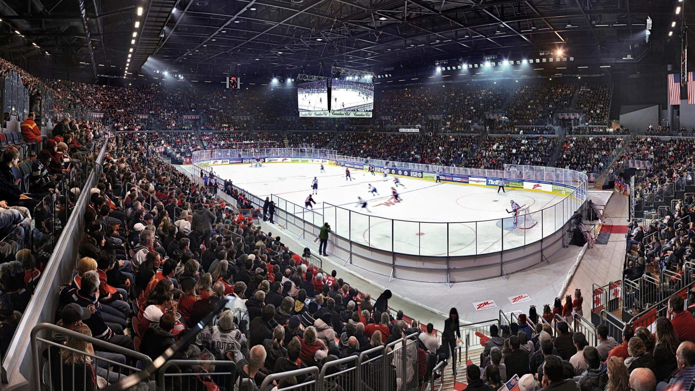 Ice hockey game being played in front of large crowd