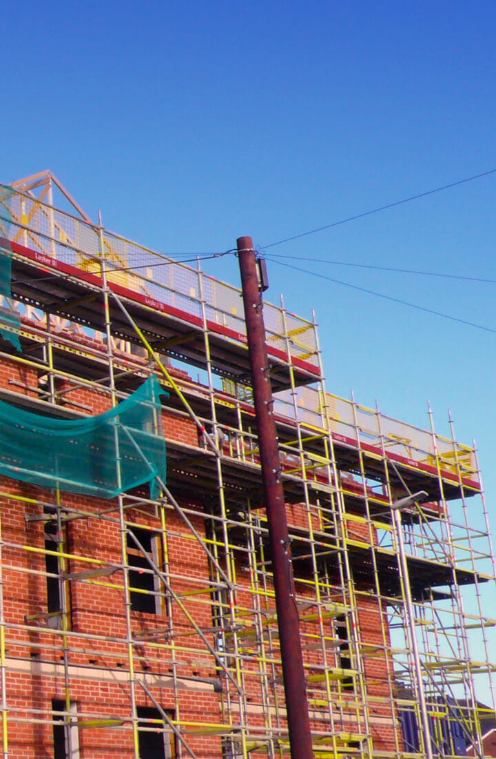 building site scaffolding blue sky
