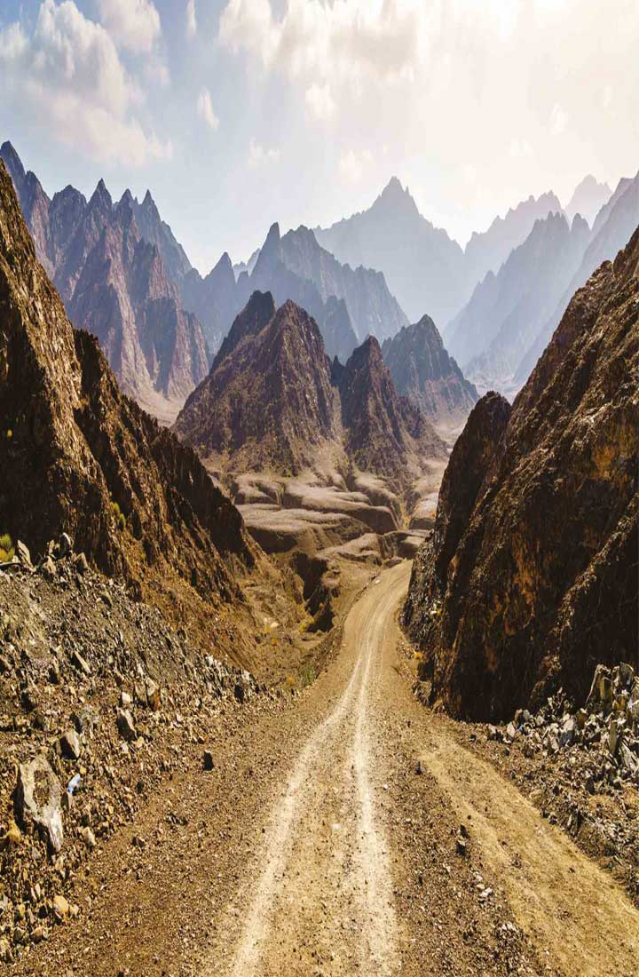Rocky road nestled between mountainous terrain