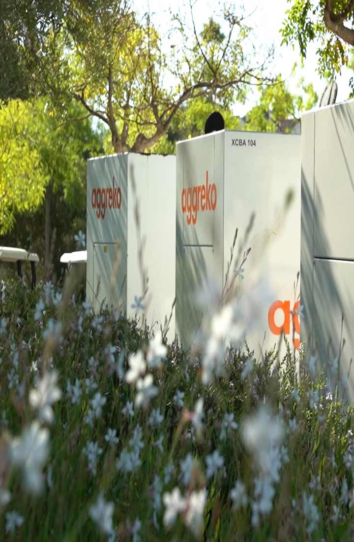 Aggreko generators located outside in amongst the flora 