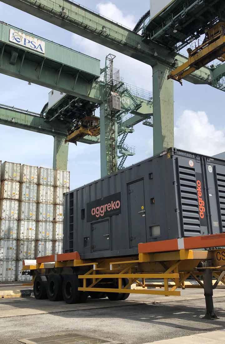 Aggreko generator being lifted by a crane